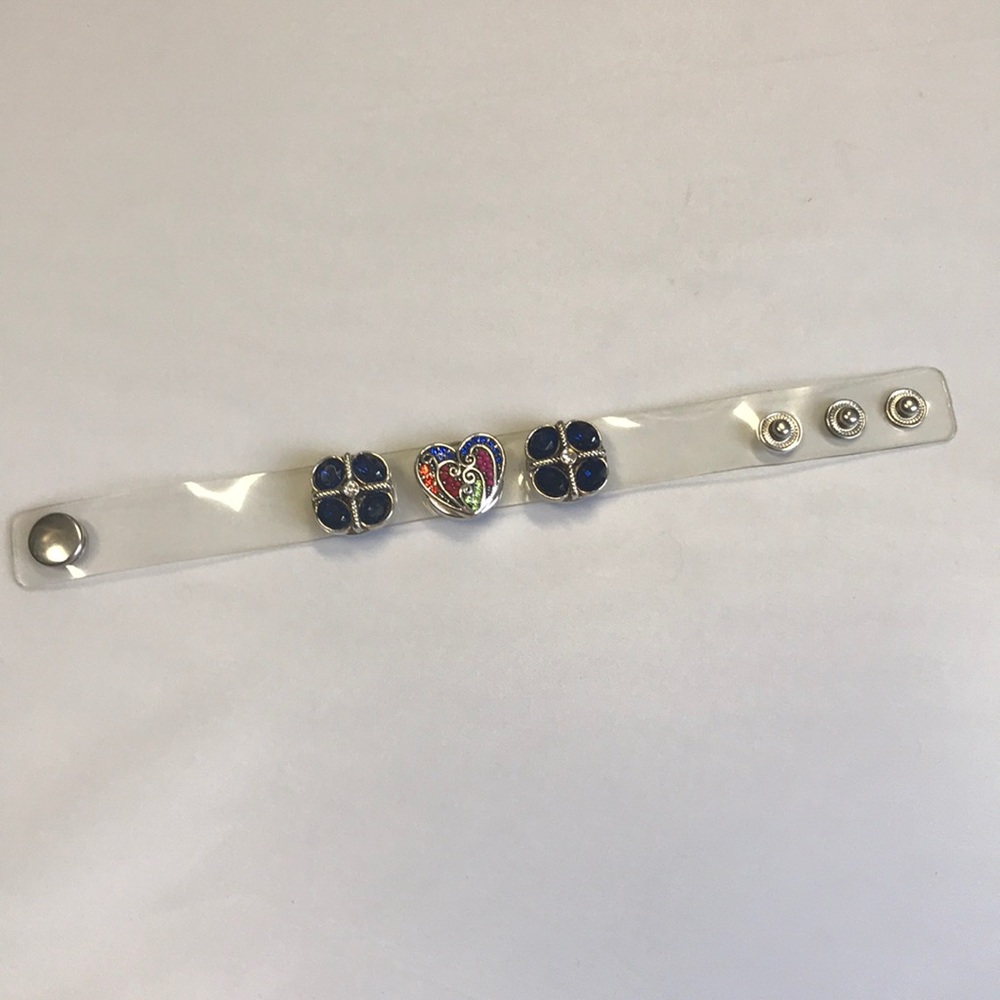 Clear plastic bracelet with bejeweled studs